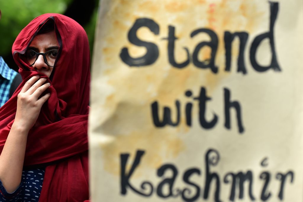 Indian students and social activists hold placards during a protest against the death of Kashmiri protestors in clashes between protestors and Indian security forces in India-administered Kashmir, in New Delhi on July 13, 2016. As the overall death toll from the violence rose to 32 on July 12, a senior state administrator said at least 1,000 people have been injured in the clashes in Kashmir, which is India's only Muslim-majority state, since Hizbul Mujahideen commander Burhan Wani was killed July 8. / AFP PHOTO / SAJJAD HUSSAIN